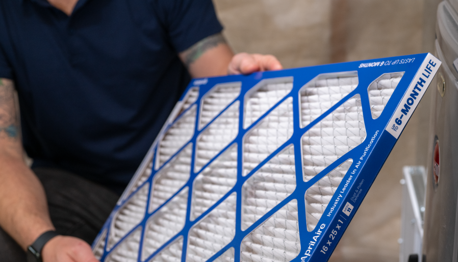 AprilAire 1in Air Filter in Contractos Hands